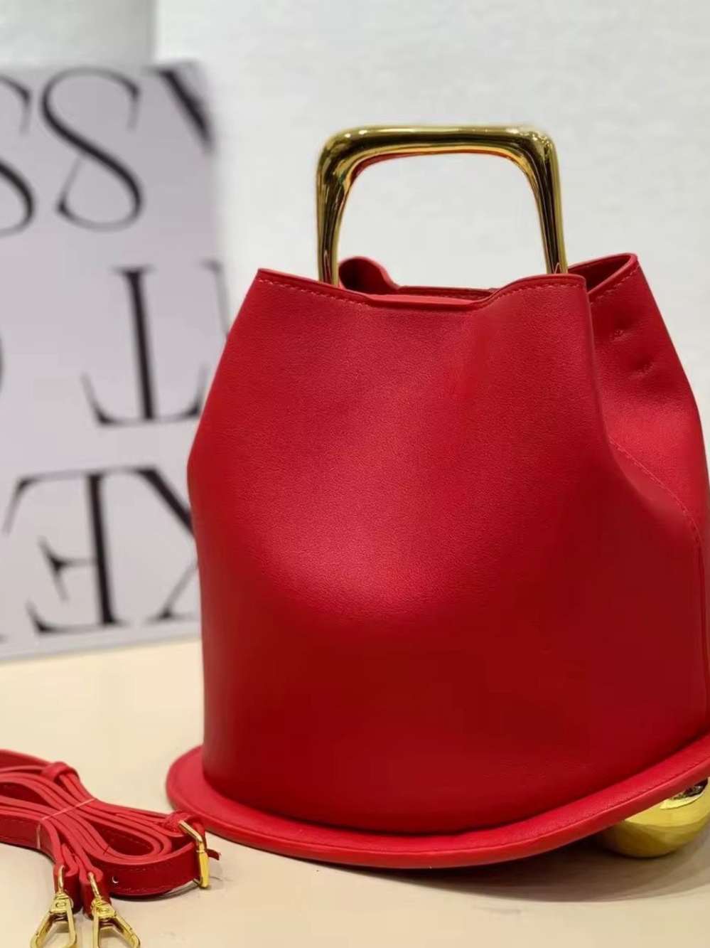Sleek Red Shoulder Bag with Gold Top Handle